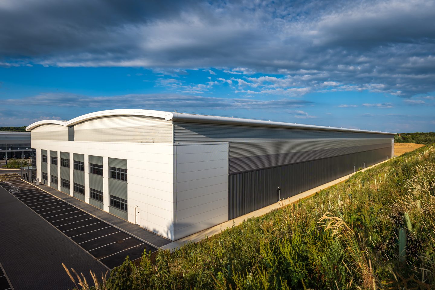 Modern distribution warehouse with dock doors and a service yard